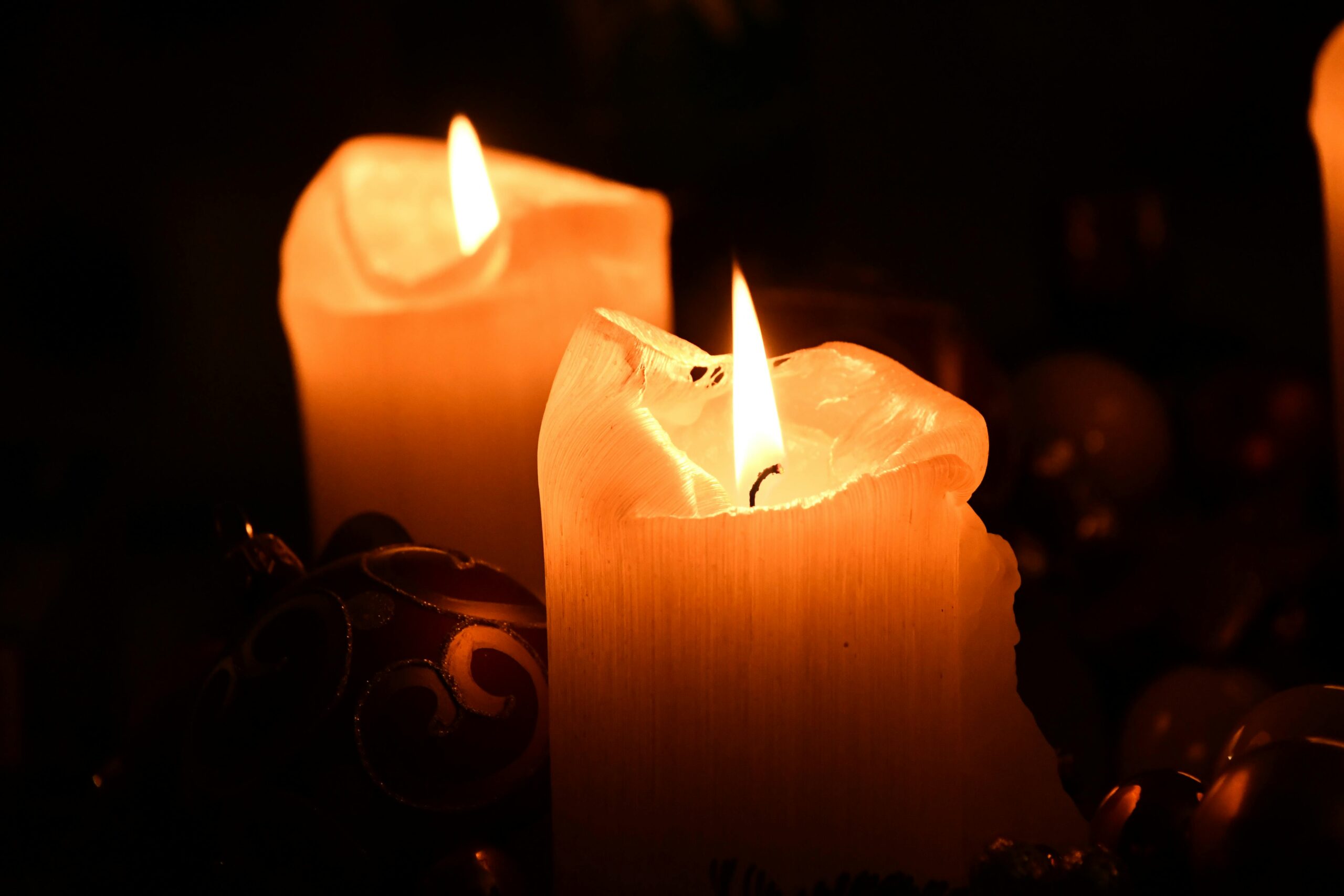 Two lit pillar candles